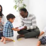 Father listening closely to child as symbol of God hearing His children