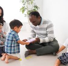 Father listening closely to child as symbol of God hearing His children